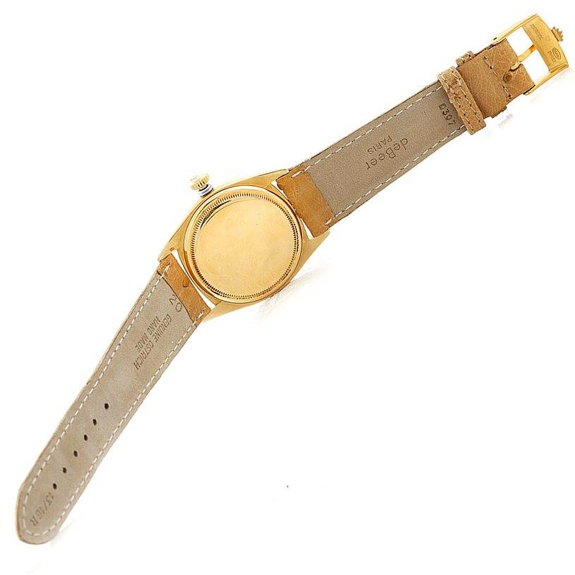 The image shows the back and strap of a Vintage Collection Rolex watch laid flat.