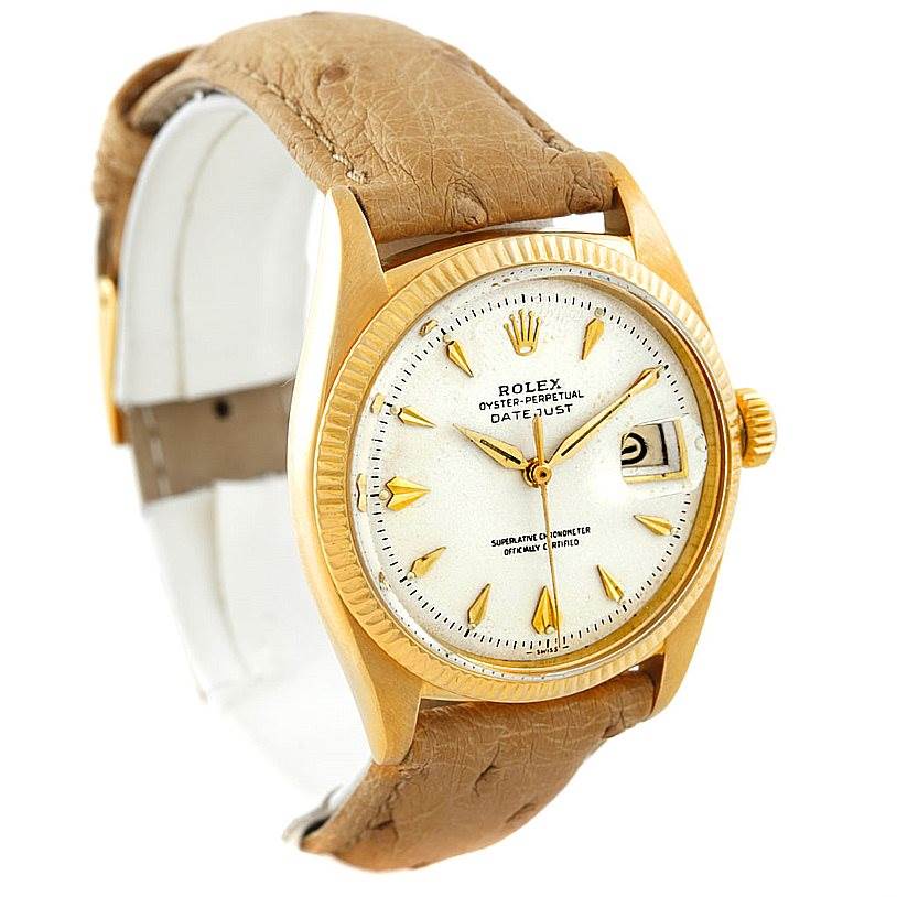 The image shows a side angle of a Rolex Vintage Collection 6605 Men's Yellow Gold Silver Dial 6605 Men's Yellow Gold Silver Dial Datejust watch, highlighting the dial, bezel, crown, and leather strap.