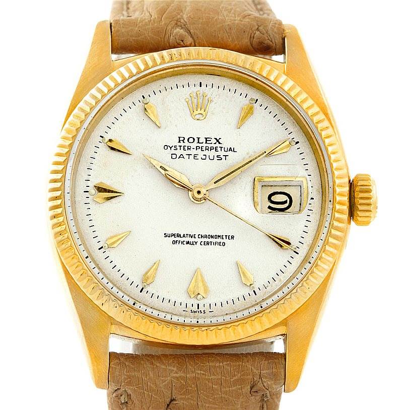 This is a close-up of the Rolex Vintage Collection 6605 Men's Yellow Gold Silver Dial 6605 Men's Yellow Gold Silver Dial Datejust watch, showcasing its face, dial, hands, crown, and part of the strap.