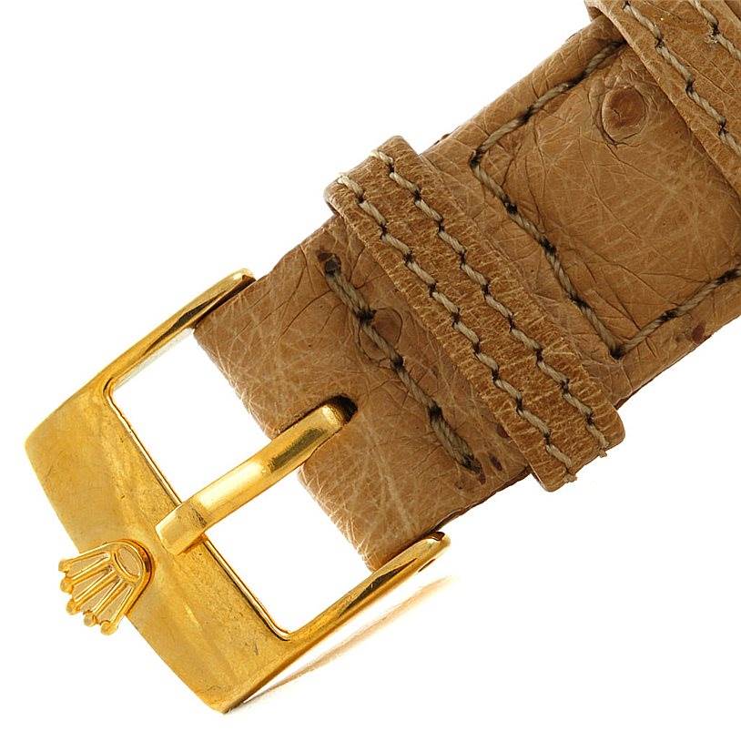 The image shows a close-up of the leather strap and buckle of a Vintage Collection model by Rolex.