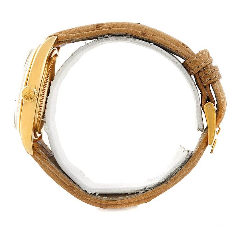 The image shows a side view of the Rolex Vintage Collection 6605 Men's Yellow Gold Silver Dial 6605 Men's Yellow Gold Silver Dial watch with a leather strap and gold case.