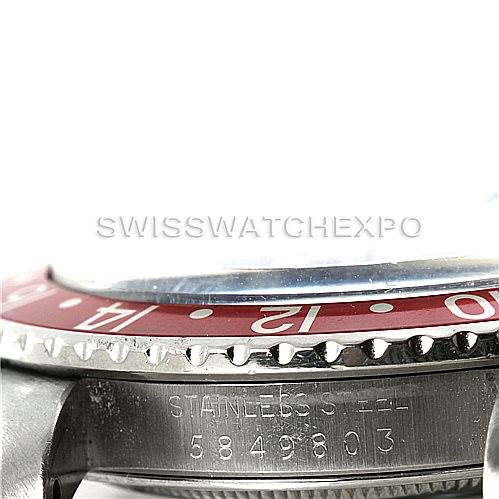 The image shows a side angle of a Rolex Vintage Collection 1675 Men's Stainless Steel Black Dial 1675 Men's Stainless Steel Black Dial watch, highlighting the bezel, crystal, and part of the stainless steel case.