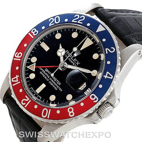 The image shows a close-up of the Rolex Vintage Collection 1675 Men's Stainless Steel Black Dial 1675 Men's Stainless Steel Black Dial GMT-Master watch, highlighting the bezel, dial, and leather strap.