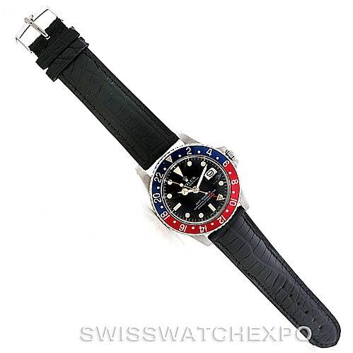 The Rolex Vintage Collection 1675 Men's Stainless Steel Black Dial 1675 Men's Stainless Steel Black Dial watch is shown from a top-down angle, displaying the face, bezel, and full strap.