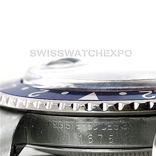 This image shows a close-up side view of the bezel and part of the case of a Vintage Collection Rolex watch with model number 1675.