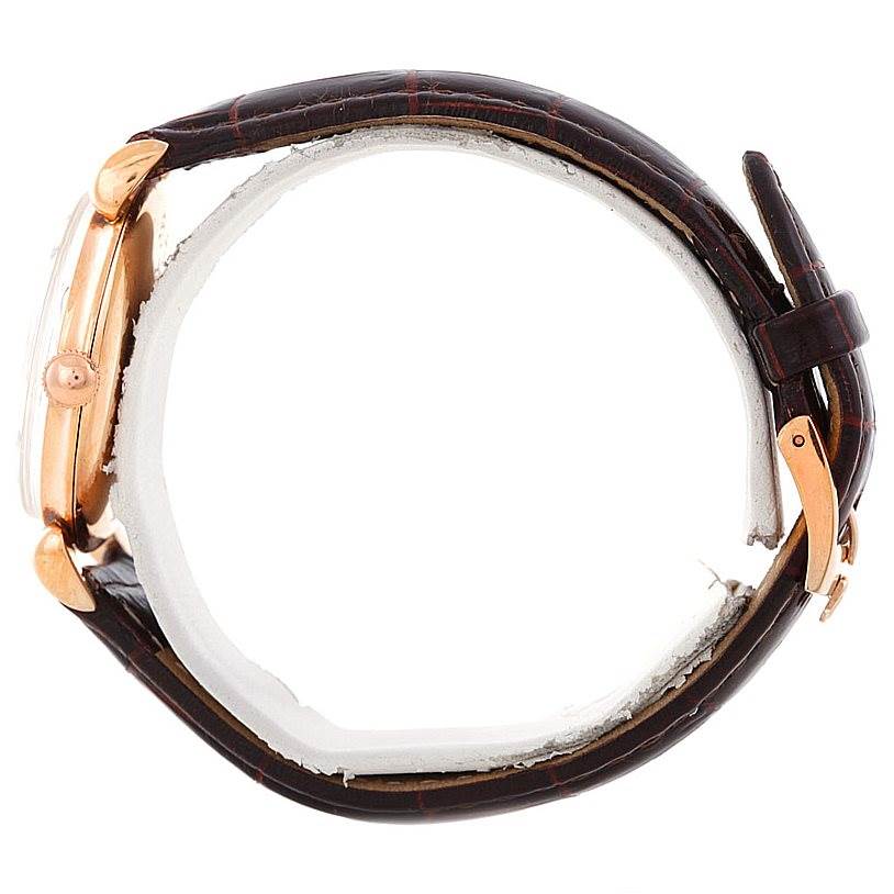 The image shows a side view of a Vintage Collection Rolex watch featuring a leather strap and a rose gold case.