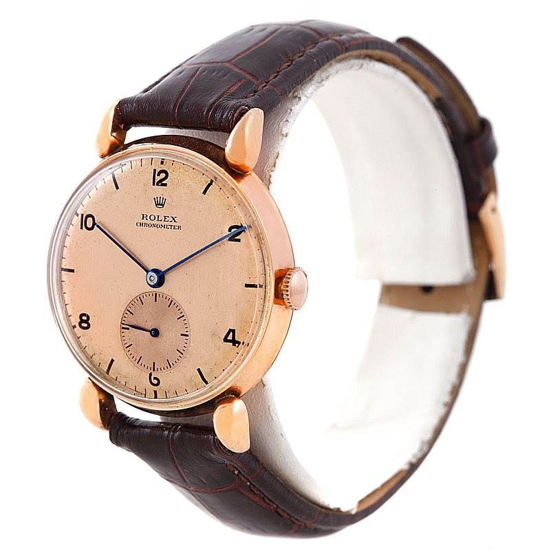 The image shows a side angle of the Rolex Vintage Collection 4273 Men's Rose Gold Pink Dial 4273 Men's Rose Gold Pink Dial model, highlighting the watch face, crown, strap, and lugs.