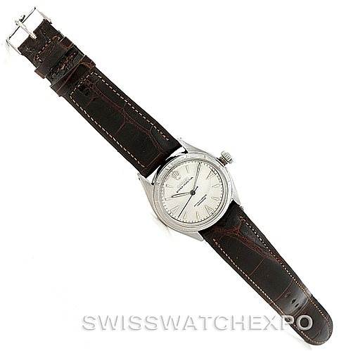 The Rolex Vintage Collection 6085 Men's Stainless Steel Silver Dial 6085 Men's Stainless Steel Silver Dial model is shown from a top-down angle, featuring the watch face and brown leather strap.