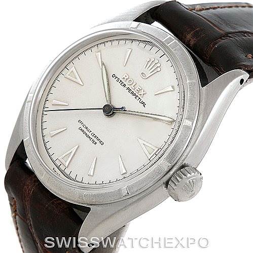 The watch shown is a Rolex Vintage Collection 6085 Men's Stainless Steel Silver Dial 6085 Men's Stainless Steel Silver Dial model, displaying the dial, bezel, crown, and part of the leather strap from an angled view.