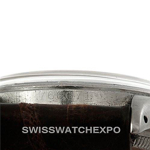This image shows a close-up of the case and leather strap of a Rolex Vintage Collection 6085 Men's Stainless Steel Silver Dial 6085 Men's Stainless Steel Silver Dial watch, highlighting the serial number.