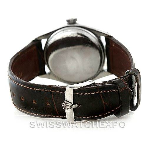 The image shows the back side and leather strap of the Rolex Vintage Collection 6085 Men's Stainless Steel Silver Dial 6085 Men's Stainless Steel Silver Dial watch, focusing on the buckle and case back.