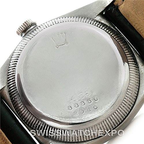 The image shows the case back of a Rolex Vintage Collection 2940 Men's Stainless Steel Silver Dial 2940 Men's Stainless Steel Silver Dial model watch, taken from a rear angle, displaying the crown logo and inscriptions.