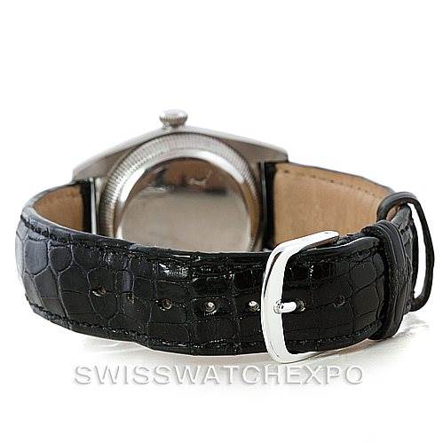 The image shows the back of a Rolex Vintage Collection 2940 Men's Stainless Steel Silver Dial 2940 Men's Stainless Steel Silver Dial watch, highlighting the case back and black leather strap with a buckle.