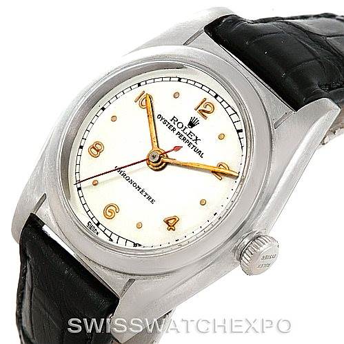 This image shows a top view of a Rolex Vintage Collection 2940 Men's Stainless Steel Silver Dial 2940 Men's Stainless Steel Silver Dial watch, focusing on the dial, case, crown, and leather strap.