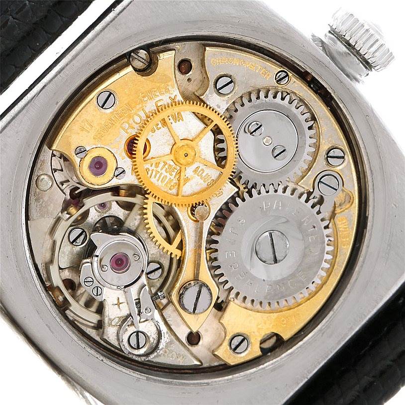The image shows the intricate internal mechanism of the Rolex Vintage Collection 3121 Men's Stainless Steel Brown Dial 3121 Men's Stainless Steel Brown Dial watch, featuring gears and moving parts.
