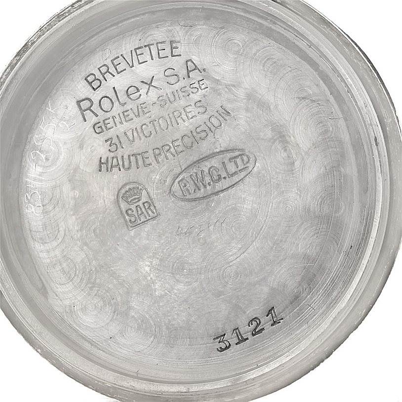 This image shows the inside of the case back of a Rolex Vintage Collection 3121 Men's Stainless Steel Brown Dial 3121 Men's Stainless Steel Brown Dial watch, displaying various inscriptions and markings.