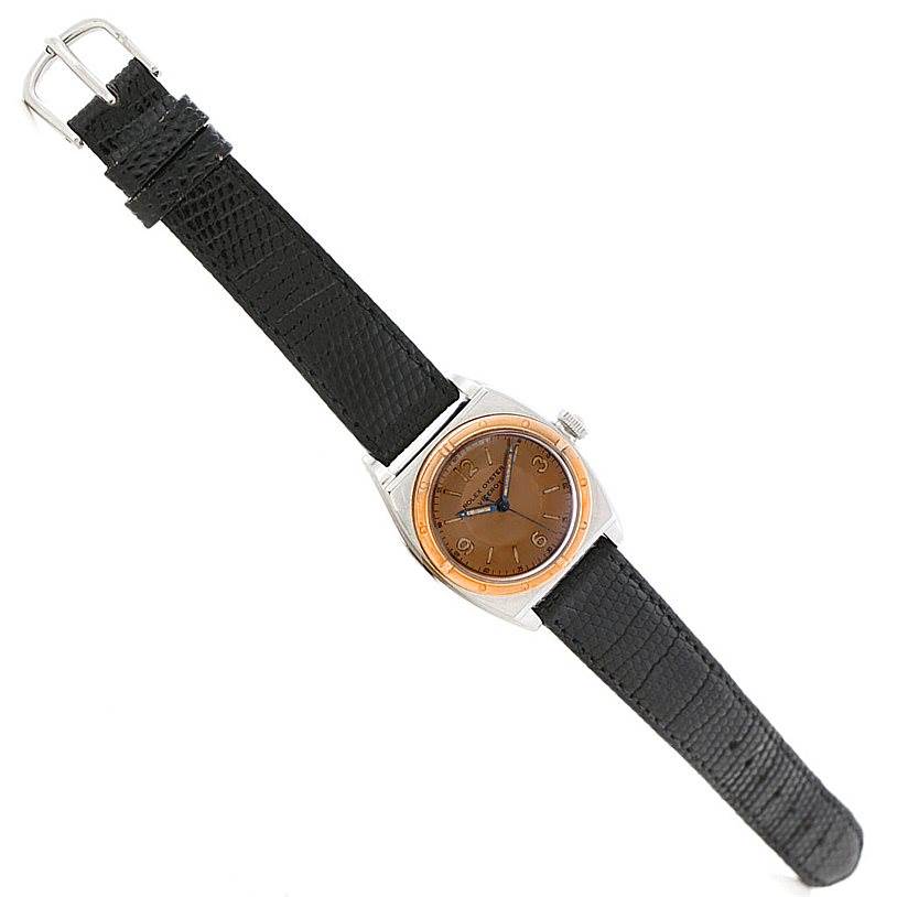 The image shows a Rolex Vintage Collection 3121 Men's Stainless Steel Brown Dial 3121 Men's Stainless Steel Brown Dial watch from a top-down angle, featuring a black leather strap and a brown dial.