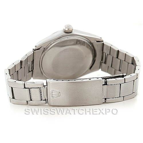 The image shows the back of a Rolex Vintage Collection 5500 Men's Stainless Steel Silver Dial 5500 Men's Stainless Steel Silver Dial watch, with its stainless steel case, crown, and bracelet clasp visible.