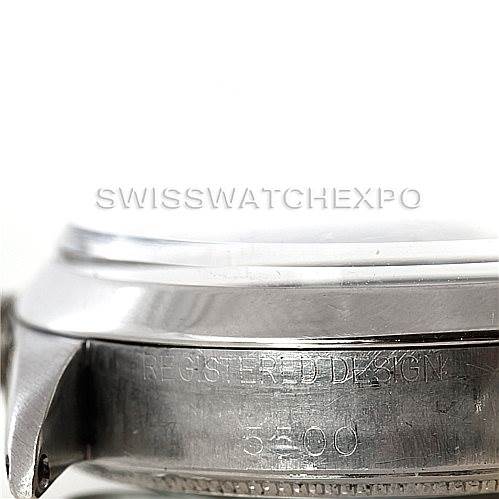 The image shows a side view of the casing for a Rolex Vintage Collection 5500 Men's Stainless Steel Silver Dial 5500 Men's Stainless Steel Silver Dial model, highlighting the engraved design and serial number.