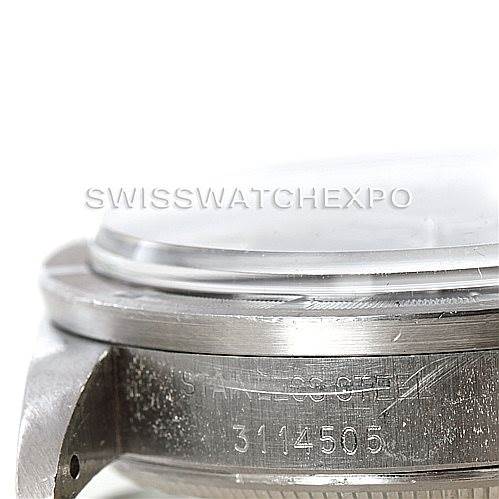 This close-up image of the Rolex Vintage Collection 1501 Men's Stainless Steel Grey Dial 1501 Men's Stainless Steel Grey Dial model shows the side view of the bezel, case, and part of the crystal.