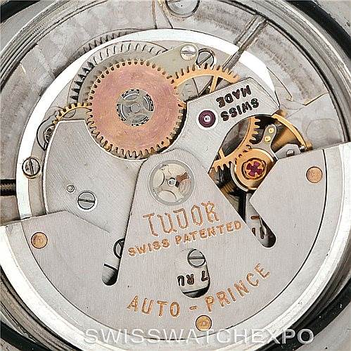 The image shows the internal movement mechanism of a Tudor Submariner 7928 Men's Stainless Steel Black Dial 7928 Men's Stainless Steel Black Dial watch, including gears, the rotor, and inscriptions.