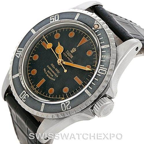 The Tudor Submariner 7928 Men's Stainless Steel Black Dial 7928 Men's Stainless Steel Black Dial watch is shown at an angled side view, highlighting the dial, bezel, crown, and part of the strap.