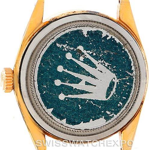 The image shows the back case of a Vintage Collection model by Rolex from a straight-on angle.