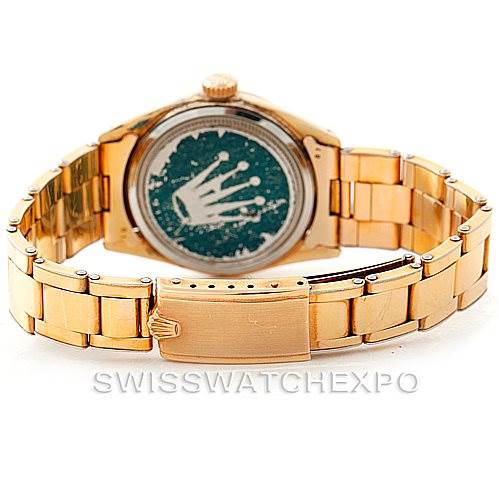 The image shows the back view of a Rolex Vintage Collection 6426 Men's Silver Dial 6426 Men's Silver Dial model watch, focusing on its gold bracelet and case back.