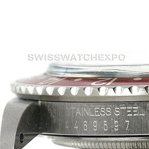 The image shows a side view of the Rolex Vintage Collection 1675 Men's Stainless Steel Black Dial 1675 Men's Stainless Steel Black Dial watch case, focusing on the bezel and engraved serial number.