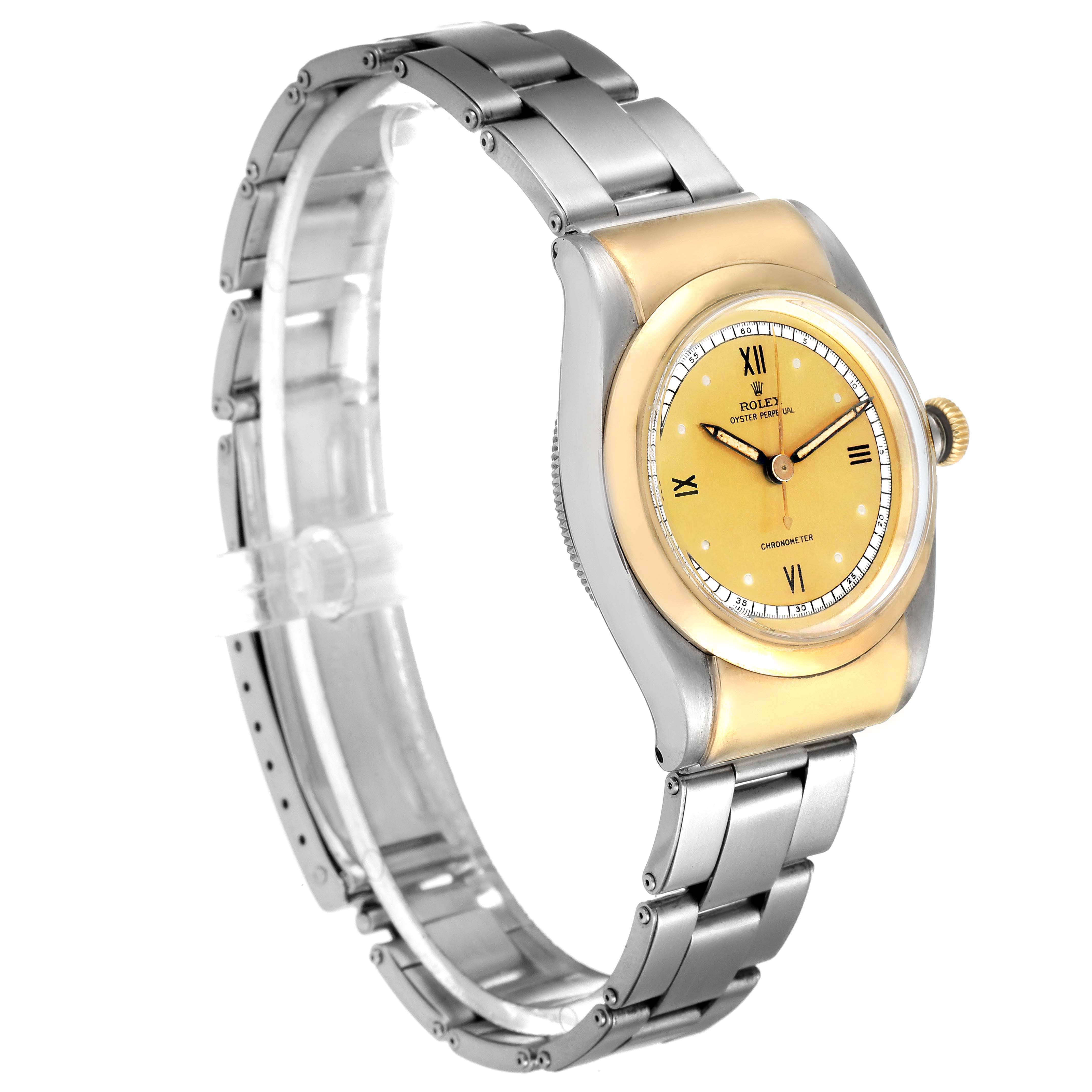 The image shows a Rolex Vintage Collection 3065 Men's Steel and Gold (two tone) Champagne Dial 3065 Men's Steel and Gold (two tone) Champagne Dial model watch from a side angle, highlighting its band, case, and dial.