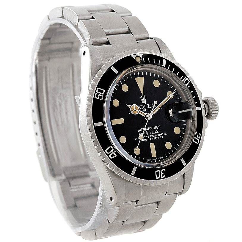 The Vintage Collection Rolex Submariner is shown from a front angle, highlighting the face, bezel, and stainless steel bracelet.