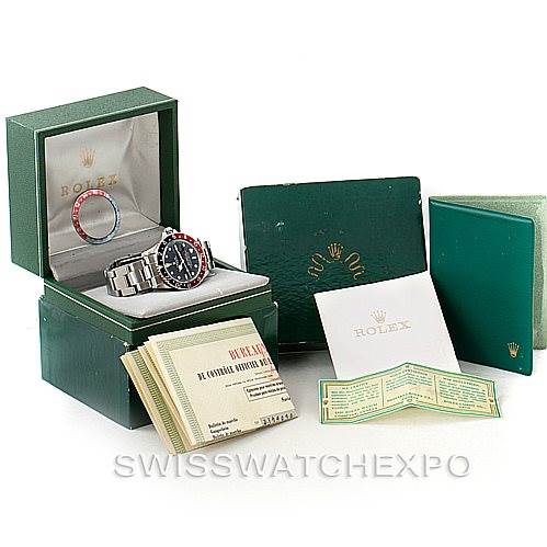 The image shows a Rolex Vintage Collection 1675 Men's Stainless Steel Black Dial 1675 Men's Stainless Steel Black Dial model watch with its box, booklets, and additional accessories from a nearly front angle.