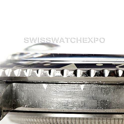 This image shows a close-up side view of a Rolex Vintage Collection 1675 Men's Stainless Steel Black Dial 1675 Men's Stainless Steel Black Dial watch, highlighting its bezel and part of the case.