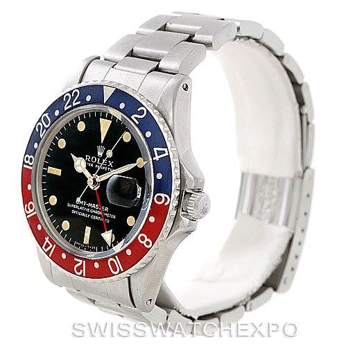 The image shows a Rolex Vintage Collection 1675 Men's Stainless Steel Black Dial 1675 Men's Stainless Steel Black Dial model watch at a three-quarter angle highlighting the face, bezel, and bracelet.