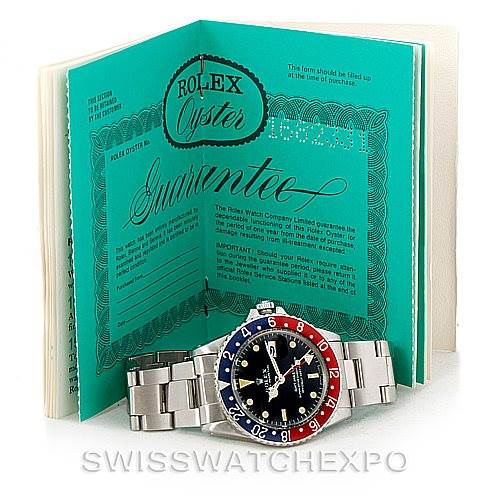 The image shows a Rolex Vintage Collection 1675 Men's Stainless Steel Black Dial 1675 Men's Stainless Steel Black Dial watch placed in front of its guarantee document.