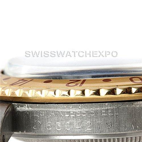 The image shows a close-up, side angle of the bezel, crystal, and part of the case of a Rolex Vintage Collection 16753 Men's Stainless Steel Brown Dial 16753 Men's Stainless Steel Brown Dial watch.
