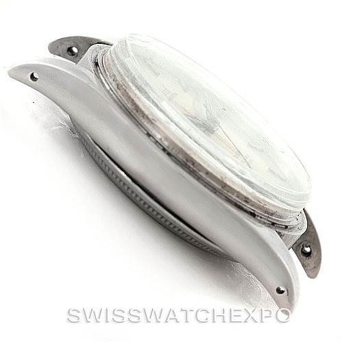 This side-angle view of a Vintage Collection model by Rolex shows the watch's case, bezel, and lugs.