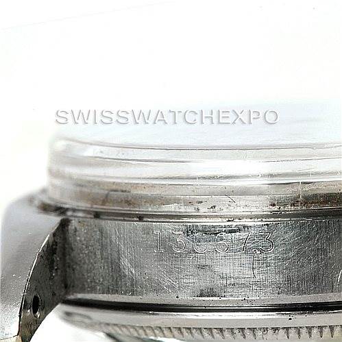 The image shows a close-up side view of the Rolex Vintage Collection 6556 Men's Stainless Steel Silver Dial 6556 Men's Stainless Steel Silver Dial watch, focusing on its case and serial number.