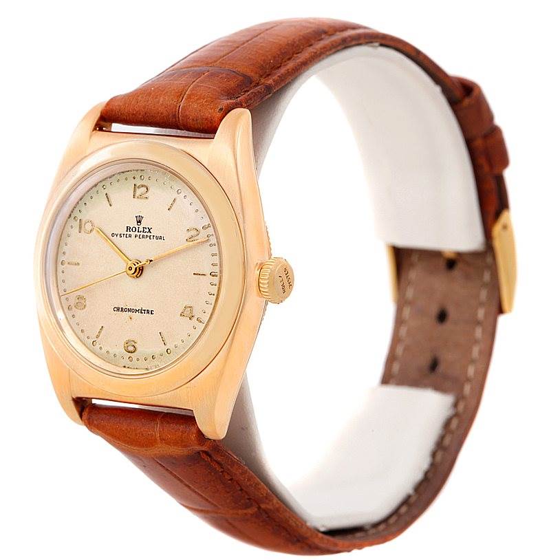 The image shows a Rolex Vintage Collection 3131 Men's Yellow Gold Silver Dial 3131 Men's Yellow Gold Silver Dial model from an angled front view, highlighting its dial, bezel, casing, and brown leather strap.