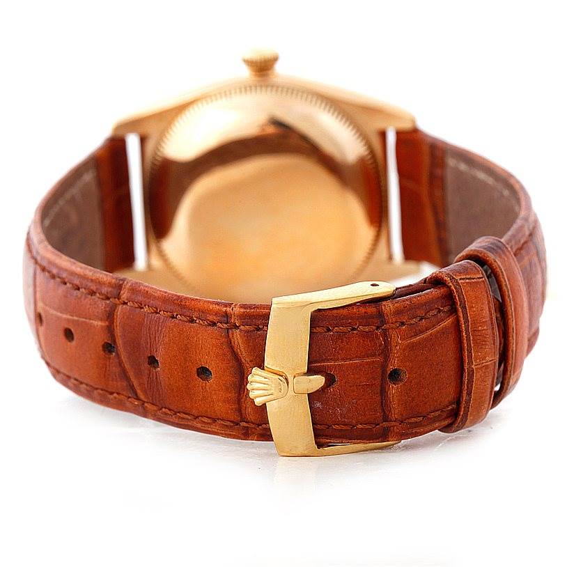 This image shows the back casing and leather strap of the Rolex Vintage Collection 3131 Men's Yellow Gold Silver Dial 3131 Men's Yellow Gold Silver Dial watch at a rear view angle.