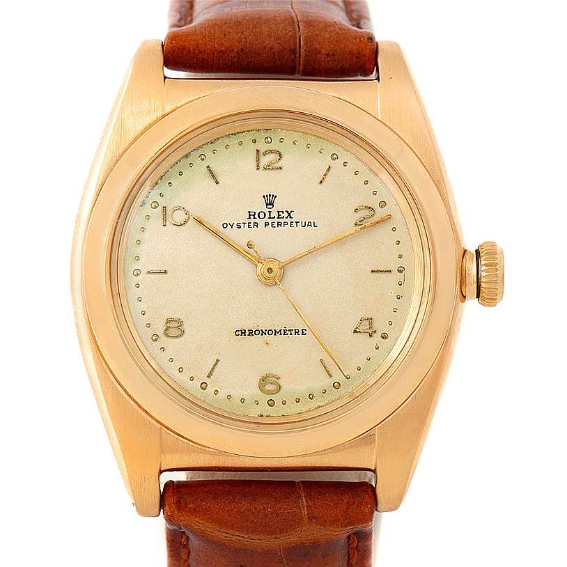 The image shows the front view of a Rolex Vintage Collection 3131 Men's Yellow Gold Silver Dial 3131 Men's Yellow Gold Silver Dial Oyster Perpetual Chronomètre watch with a leather strap.