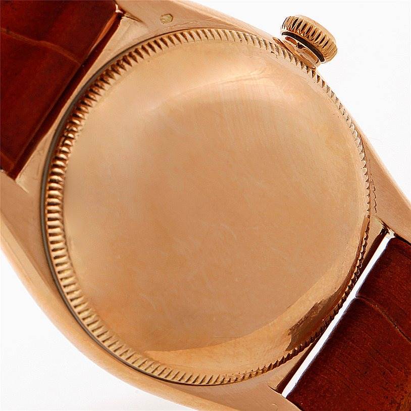 The image shows the back case and crown of the Vintage Collection model by Rolex, viewed from the side.