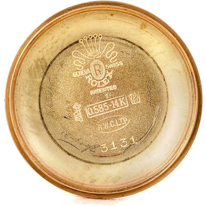 The image shows the inner case back of a Rolex Vintage Collection 3131 Men's Yellow Gold Silver Dial 3131 Men's Yellow Gold Silver Dial watch, displaying various engravings and hallmarks.