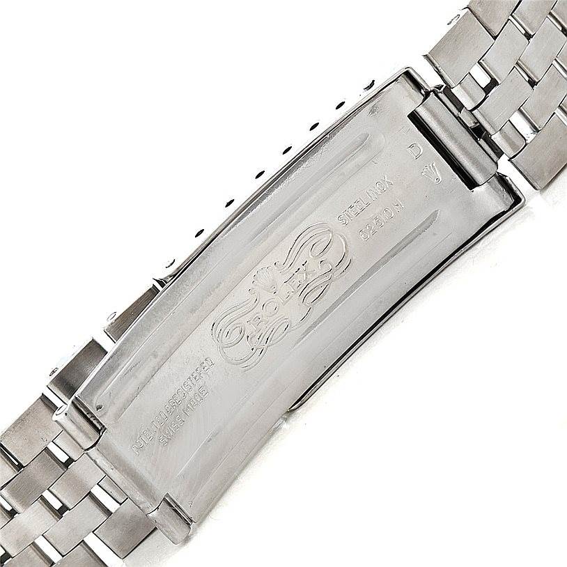 The image shows the clasp of the Rolex Vintage Collection 1601 Men's Stainless Steel Silver Dial 1601 Men's Stainless Steel Silver Dial watch, displaying the engraved logo and some model information.