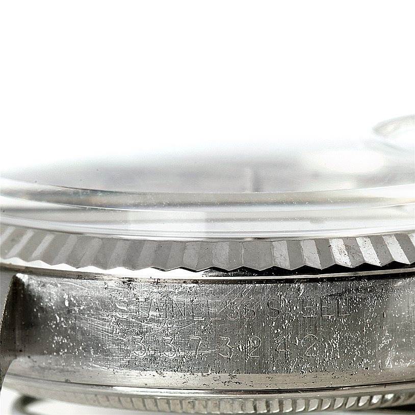 This image shows a close-up of the side of the bezel, case, and crystal of a Vintage Collection model by Rolex.