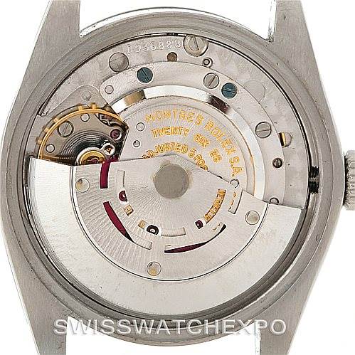 The image shows the back of the Rolex Vintage Collection 1500 Men's Stainless Steel White Dial 1500 Men's Stainless Steel White Dial model, revealing its mechanical movement and intricate internal parts.