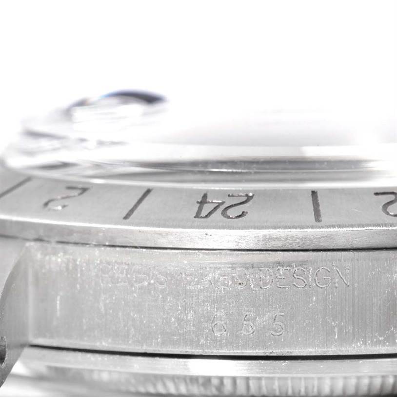 The image shows a close-up side view of the bezel, crystal, and case of a Rolex Vintage Collection 1655 Men's Stainless Steel Black Dial 1655 Men's Stainless Steel Black Dial model watch.