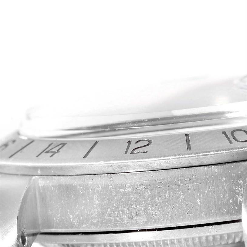 This image shows the side angle of the bezel and case of a Rolex Vintage Collection 1655 Men's Stainless Steel Black Dial 1655 Men's Stainless Steel Black Dial watch, focusing on the engraved numbers and text.