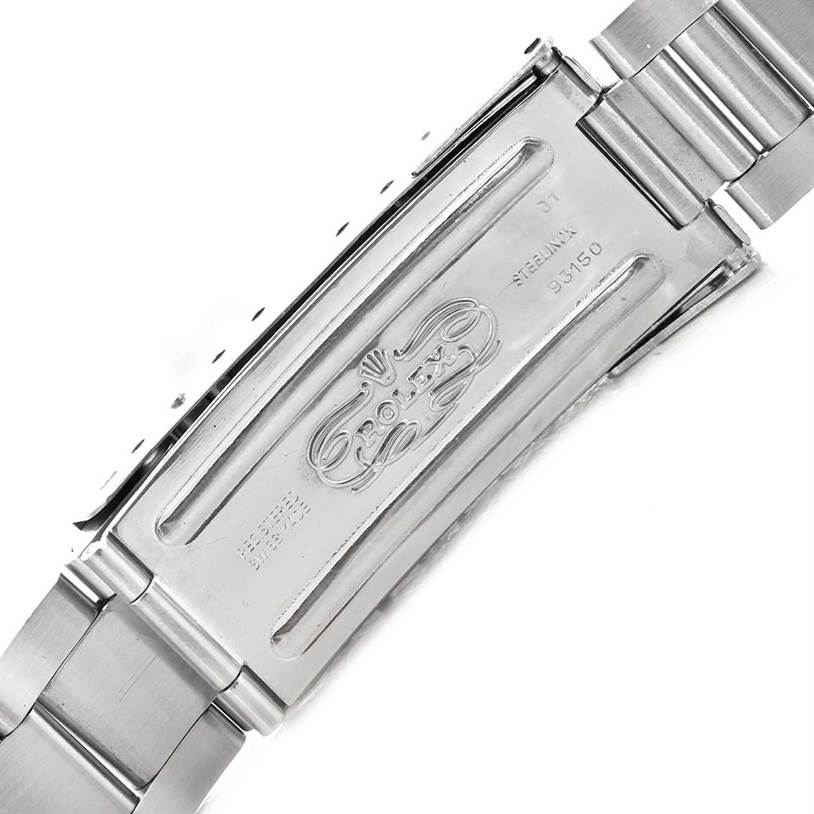 The image shows a close-up of the clasp and part of the metal bracelet of a Vintage Collection Rolex watch.