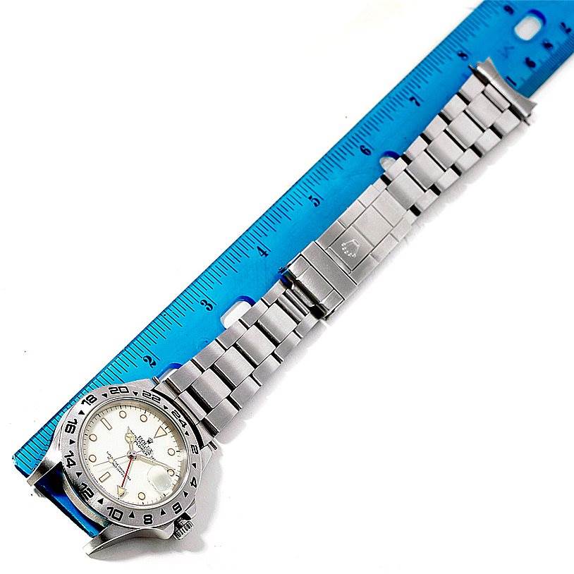 This image shows a Rolex Vintage Collection 16550 Men's Stainless Steel Beige Dial 16550 Men's Stainless Steel Beige Dial watch laid flat, displaying the face, bezel, and metal bracelet next to a blue ruler with centimeter markings.